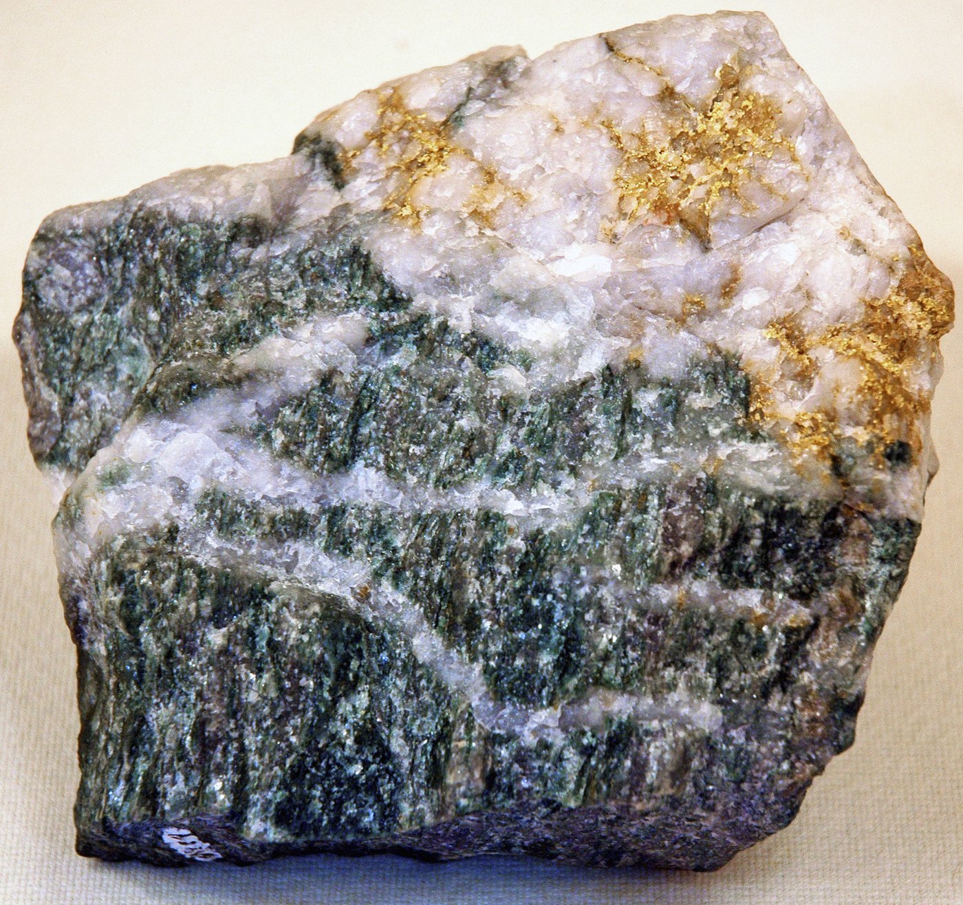 Gold-bearing quartz vein specimen with visible native gold
